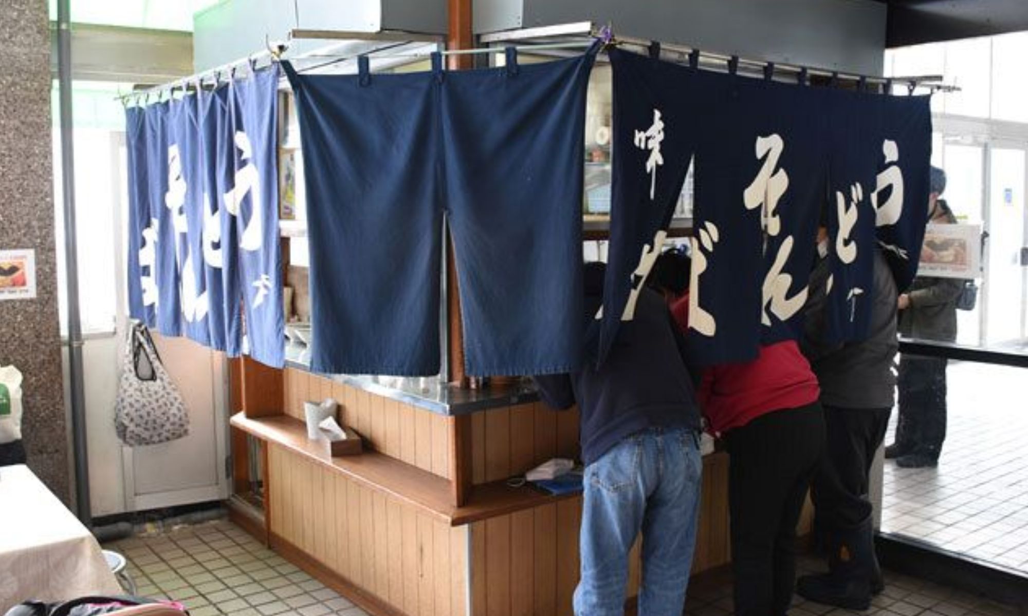 Small standing noodle bar counter at a Japanese station